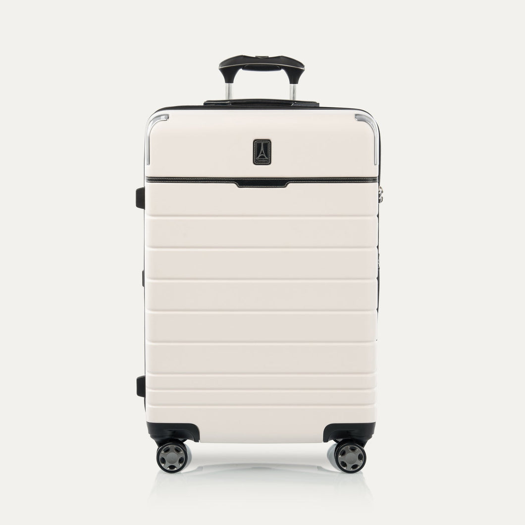 A medium-sized check-in spinner suitcase with a hard White Sand shell, wheels, and an ergonomic handle.