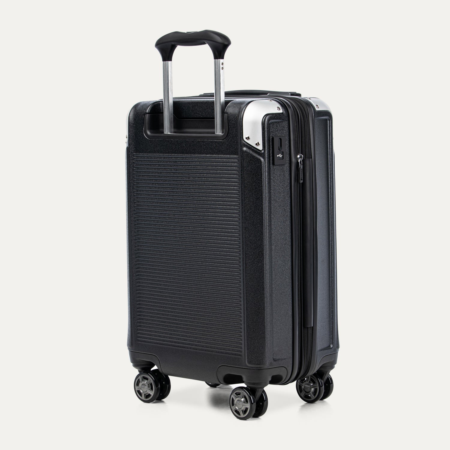 Black suitcase with wheels and handle on a white background