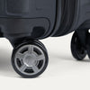 Close-up of suitcase wheels on a white background