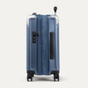 Side view of expanded blue suitcase with combination lock on a white background