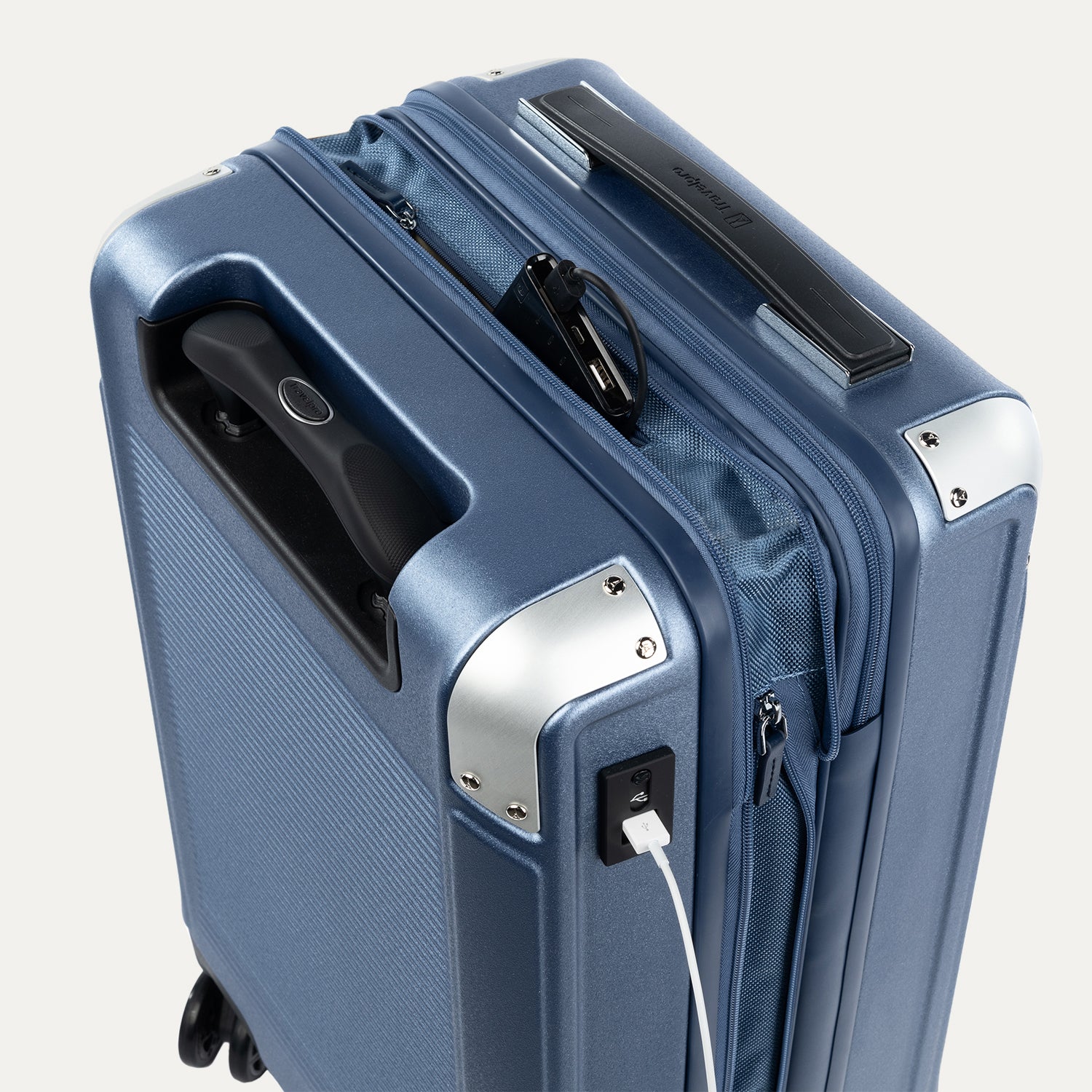 Close-up of a blue suitcase with USB cable outlet on a white background.