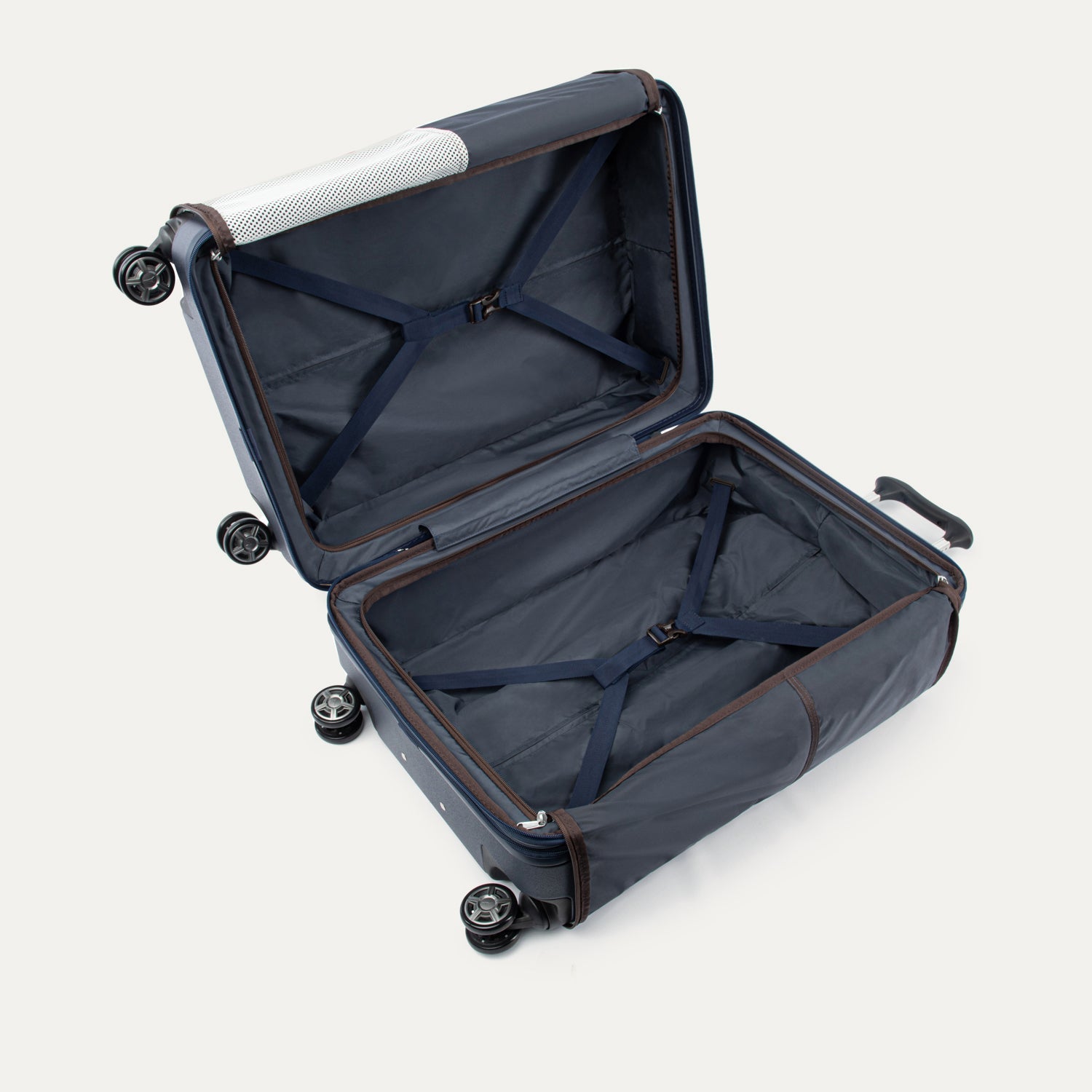 Open navy suitcase with black wheels on a white background