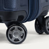 Close-up of suitcase wheels on a white background