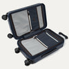 Open navy suitcase with black wheels on a white background