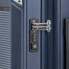 Close-up of a suitcase lock on a blue suitcase.