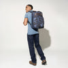 Man carrying the Platinum® Elite Business Backpack in Camouflage