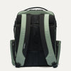 Back view of a green and black backpack on a white background