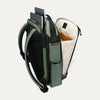 Green backpack with compartments and a laptop sleeve on a white background