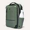Green backpack with a water bottle in a pocket on a light gray background