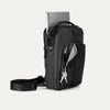 Front-right view of the Travelpro Altitude Crossbody 6L in Black, featuring a tablet compartment and key leash.
