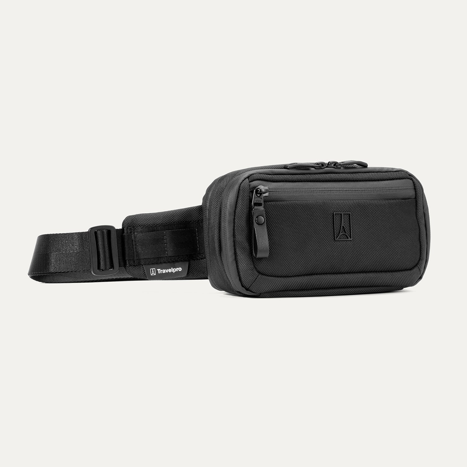Travelpro Altitude Sling 2L in Jet Black, showing front zip pocket and adjustable strap with Travelpro tag.

