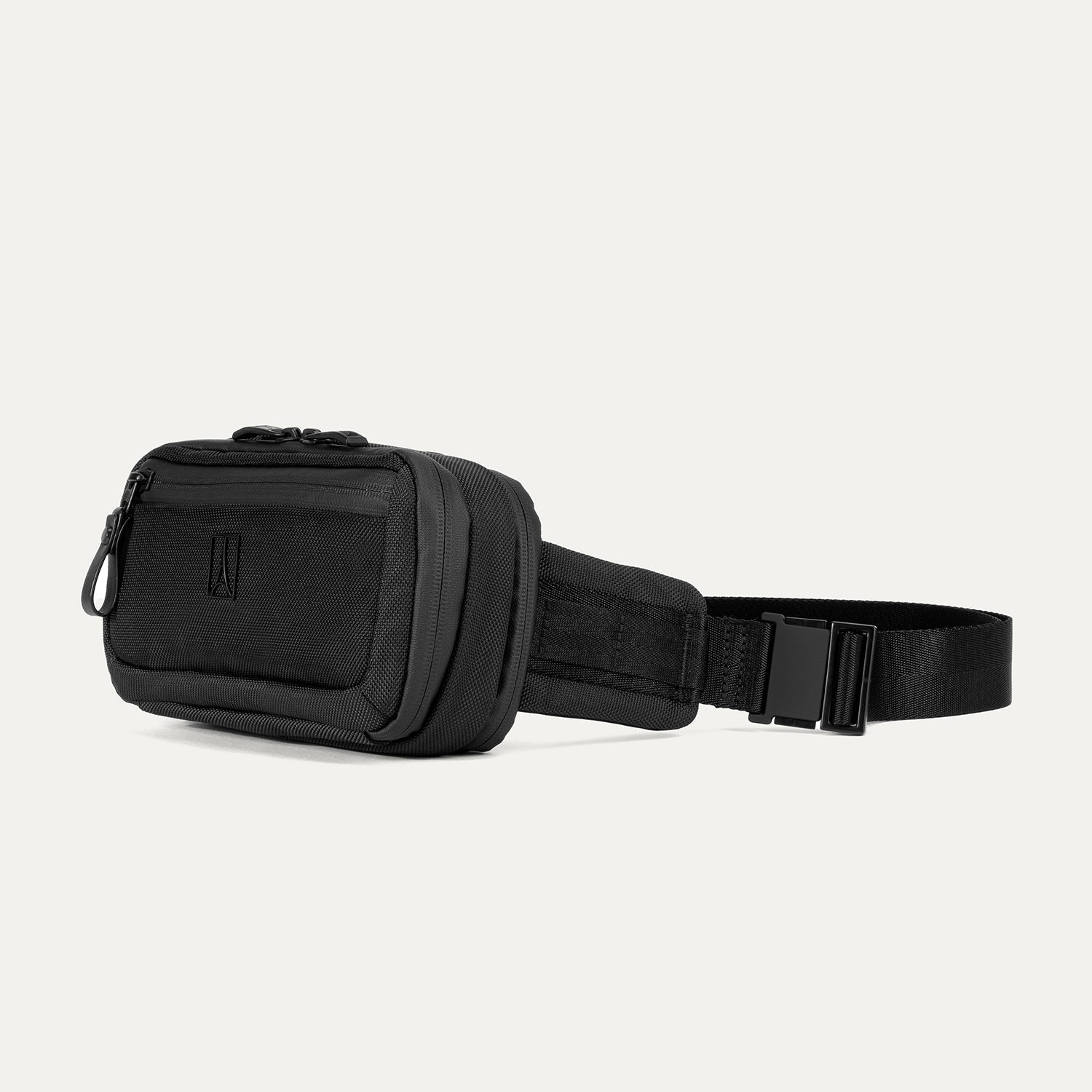Travelpro Altitude Sling 2L in Jet Black, featuring an exterior zip pocket and adjustable waist strap.
