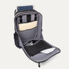 Gray backpack with compartments containing a tablet, notebook, and other items on a white background