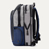 Side view of expanded Travelpro Altitude All-Purpose Backpack in Stellar Navy/Grey, showing exterior side compartments.
