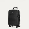 Three-quarter view of the Optima Expandable Compact Carry-on Spinner in Black, showcasing the sleek, durable polypropylene hardshell design, vertical ribbing, and smooth mobility on multi-directional spinner wheels.