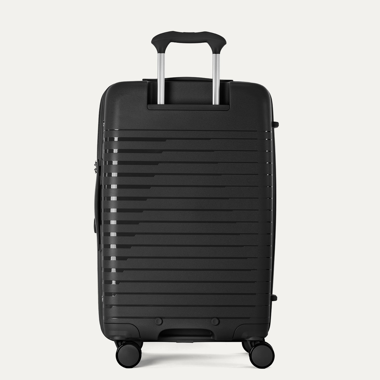 Rear view of the Optima Expandable Medium Check-in Spinner in Black, showcasing the adjustable PowerScope extension handle and the sleek, ribbed hardside exterior.