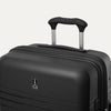 Close-up detail view of the top of the Optima Expandable Medium Check-in Spinner in Black, highlighting the extended PowerScope handle, top carry handle, and Travelpro branding on the hardside shell.