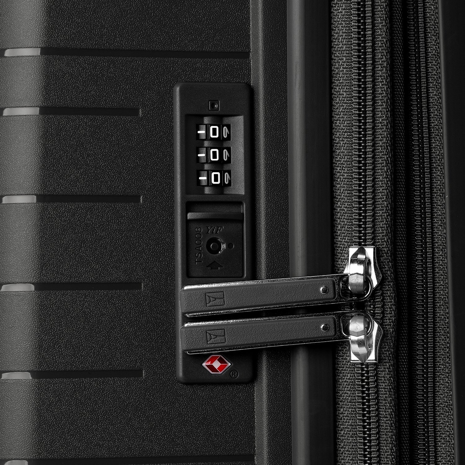 Close-up detail view of the TSA-compliant combination lock on the Optima Expandable Medium Check-in Spinner in Black, showcasing the integrated security feature designed for safe and accessible travel.