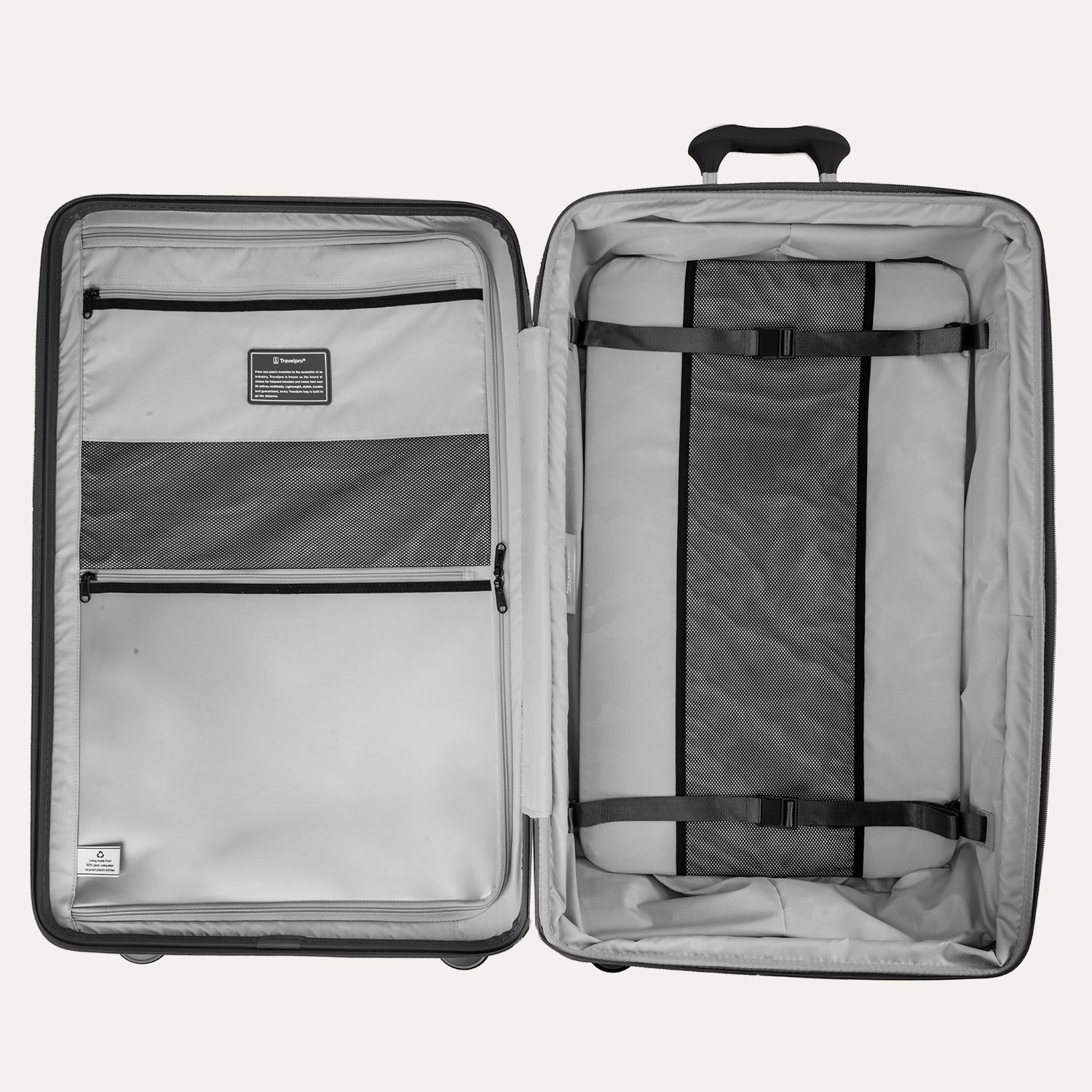 Interior view of the Optima Expandable Large Check-in Spinner in Black, featuring a built-in compression panel, zippered divider, and multiple accessory pockets to help keep packed items organized and secure.
