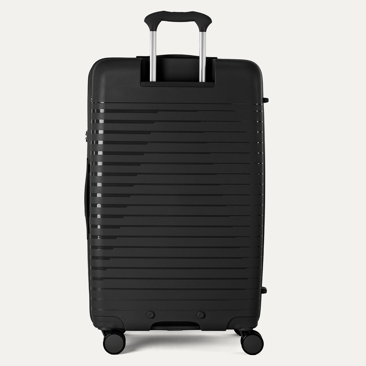 Rear view of the Optima Expandable Large Check-in Spinner in Black, showcasing the adjustable PowerScope extension handle and the sleek, ribbed hardside exterior.